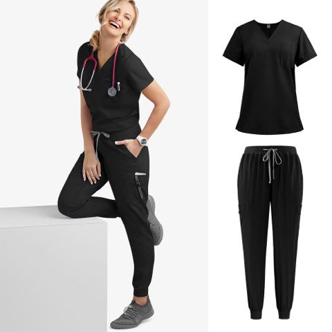 A woman wearing a black V-neck short-sleeve scrub top and matching jogger-style scrub pants.