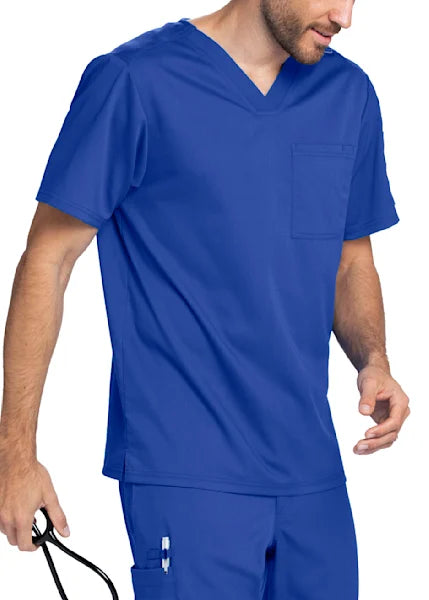 A person wearing a royal blue Cherokee Workwear unisex V-neck scrub top and matching scrub pants.